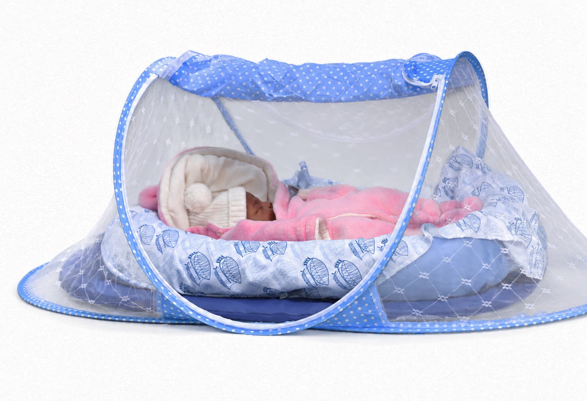 A newborn settled and fast asleep inside a Che Nest at home