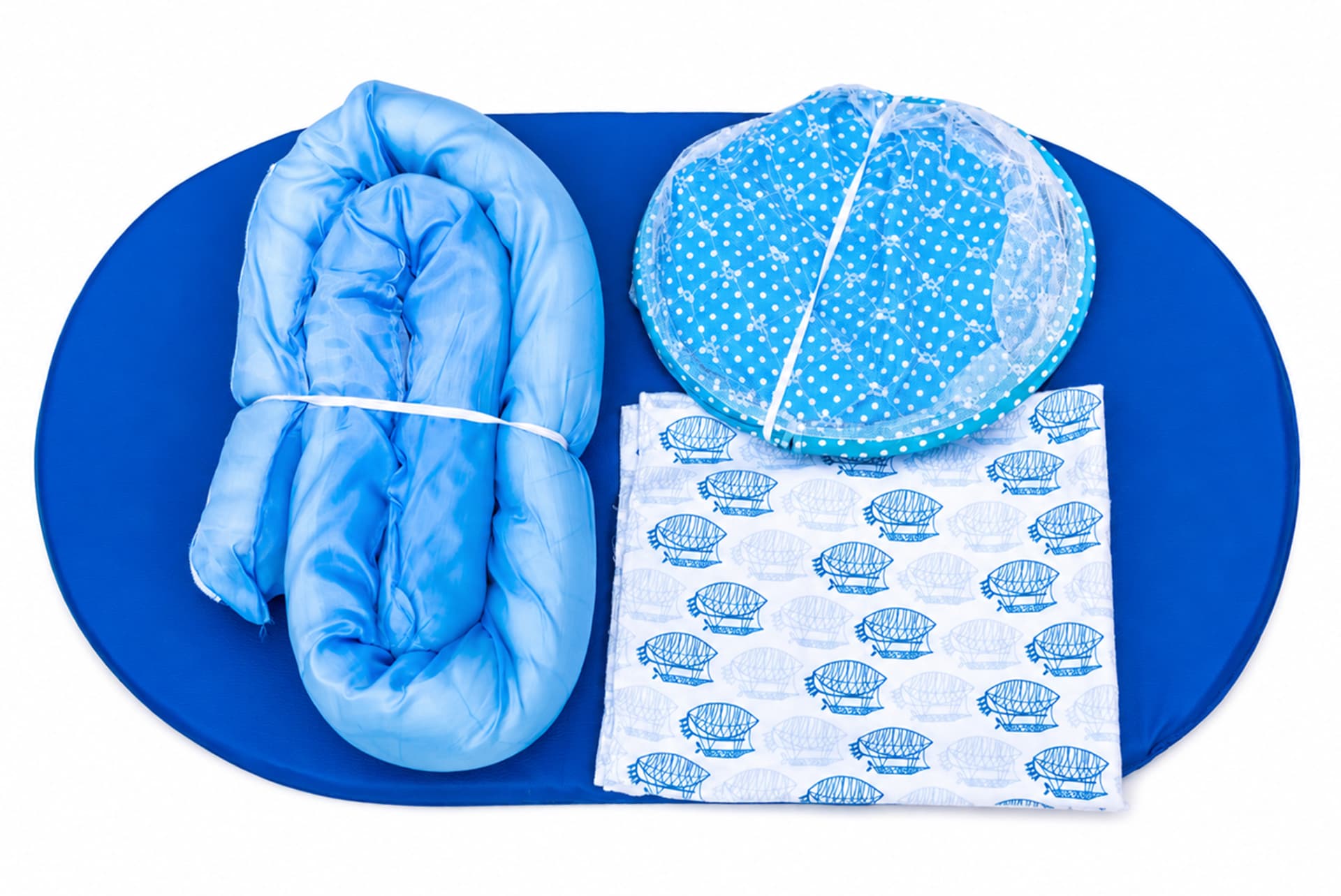 Che Nest travel package with nest, mattress and mosquito net laid out ready to pack